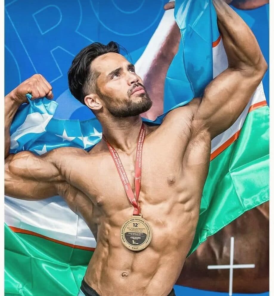 Champion with medal and the flag of Uzbekistan